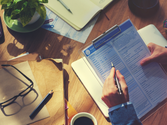 Hipster Man Casually Filing In The Application Form Concept